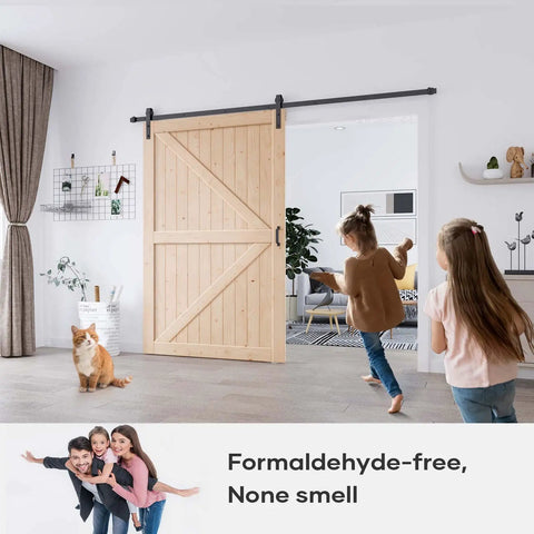 Solid Spruce Wood Sliding Barn Door 54X84 with kids playing and a cat, showcasing a farmhouse vibe in a modern room.