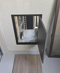 Heavy Duty Aluminum Lockable Drywall Access Panel Slick Black Flush Mount Wall Hatch showing open access to hidden interior space.