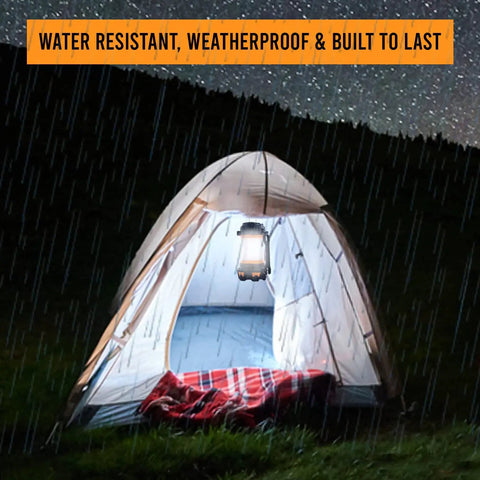 Rechargeable LED Camping Lantern With 360 Degree Illumination lighting up a tent in rainy night, IPX4 waterproof for camping
