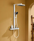 Exposed Shower Faucet System Piano Key Diverter Control White mounted on wall with rain shower head and hand shower.