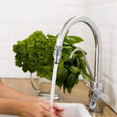 Sink to Hose Adapter Solid Brass 360 Degree Swivel Quick Connector attached to kitchen faucet with running water