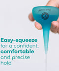 Hand holding Quad Stream Ear Syringe Kit For Gentle Ear Wax Removal With 75 Ml Bulb, easy-squeeze turquoise syringe bulge.