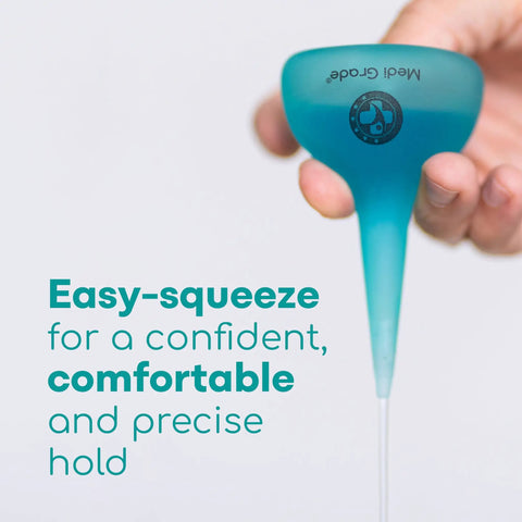 Hand holding Quad Stream Ear Syringe Kit For Gentle Ear Wax Removal With 75 Ml Bulb, easy-squeeze turquoise syringe bulge.