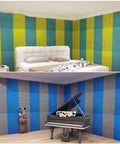 Premium Peel And Stick Acoustic Foam Panels in colorful striped pattern on walls of a bedroom and recording studio.