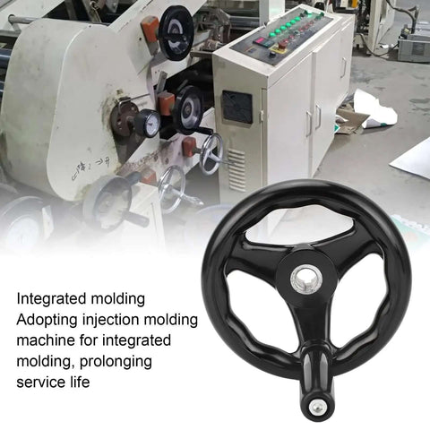 Beefy Heavy Duty Lathe Hand Wheel 160mm Diameter With 16mm Mounting Hole shown in workshop setting with machinery