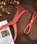 Red Bent Leg Pottery Calipers Dual Size Measuring Rulers For Clay Sculpting Ceramic Crafting on a brown surface.
