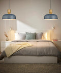 Lit Hammered Metal Pendant Light With Adjustable Height Modern Ceiling Hanging Fixture over bed in cozy bedroom.