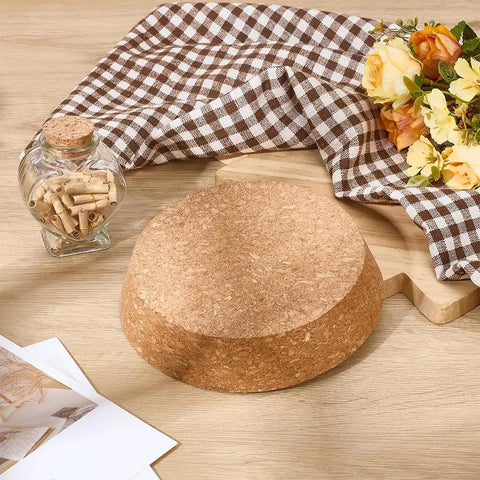 Two Pack Large Cork Stoppers For Bottles And Jars 5 To 6 Inch Tapered Wood Bottle Lids on wooden surface with flowers