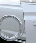 Close-up of Heavy Duty Car Door Edge Guard Strip For Tesla Cybertruck, chrome strip resting on vehicle door.