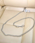 Badass Stainless Steel Dog Car Seatbelt No Chew Pet Safety Restraint Cable on car seat, showcasing durable chain and clips.
