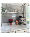 Peel And Stick White Marble Vinyl Countertop Backsplash Wrap 36 By 180 Inches Waterproof Self Adhesive Contact Paper in kitchen.