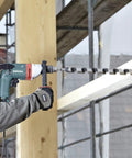 Heavy Duty One Half Inch High Torque Drill With Solid Six Point Seven Amp Motor and Wide Speed Range from Zero to Six Hundred Fifty Rpm drilling into wood beams