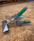 Sheet Metal Hand Seamer With 1/4 Inch Increment Marks, Heavy-Duty Steel Build, Comfortable Grip on a wood surface