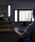 Person using dual monitors at desk with website and file explorer open, representing Bootable USB Repair Kit For Windows PCs With Antivirus Data Recovery And Password Reset For Tech Pros To Fix Boot Issues And Restore System Health Dual USB A And USB C Boot Drive For UEFI And Legacy BIOS.
