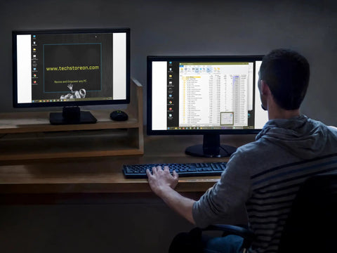 Person using dual monitors at desk with website and file explorer open, representing Bootable USB Repair Kit For Windows PCs With Antivirus Data Recovery And Password Reset For Tech Pros To Fix Boot Issues And Restore System Health Dual USB A And USB C Boot Drive For UEFI And Legacy BIOS.