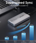 Next Level 80Gbps M.2 NVMe SSD Enclosure With Thunderbolt 5 And USB4 V2 Support on a desk beside a laptop.