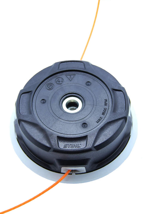 Top view of AutoCut C 26-2 Trimmer Head With Easy-Load Auto-Feed, compatible with select gas trimmers, shown with line feed.