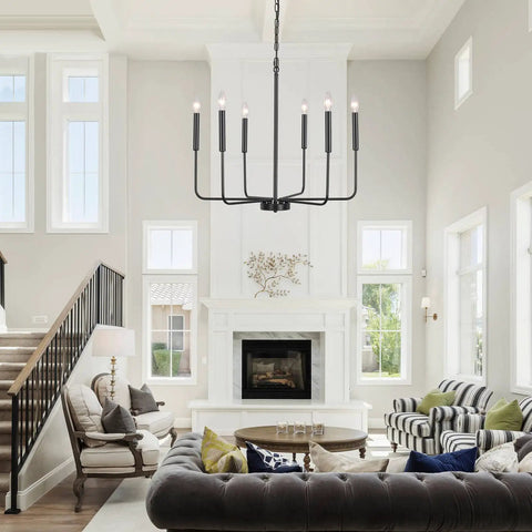 Black 6 Light Farmhouse Chandelier With Industrial Iron Vibe For Dining Room Living Room Kitchen Island And Foyer, Adjustable Height Chain Up To 66.9 Inches, Modern Rustic Ceiling Lighting Fixture in a spacious living room setting.