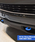 Close-up of Blue Front Tow Hook Covers Set Of 2 For 2007 To 2024 Chevy Silverado 1500 on vehicle bumper.