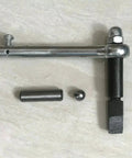 Top view of clutch repair kit components: chrome mounting rod with bolt, black shifting shaft, pin and ball
