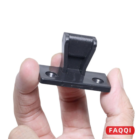 Invisible Panel Clips And Push Fit Fasteners Provide Zero Sweat Assembly For Furniture With Boss Level Concealed Hardware That Keeps Cabinets Looking Pristine. Black plastic clip held in hand, ideal for clean furniture joints.