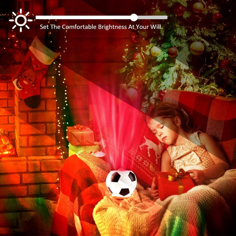 Child resting with Soccer Ball Shaped Constellation Projector Night Light With Bluetooth Speaker And USB Charger illuminating room