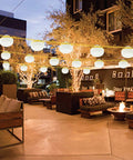 Outdoor patio with Industrial Grade Construction String Lights LED For Job Sites Renovations Extendable 200 Foot Portable Lighting