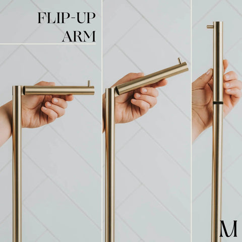 Close-up of flip-up arm on Freestanding Toilet Paper Holder With Storage For Four Rolls, Renter Friendly Stainless Steel Stand In Luxury Brushed Gold Finish, No Install Needed For Easy Bathroom Refresh And Tidy Space.
