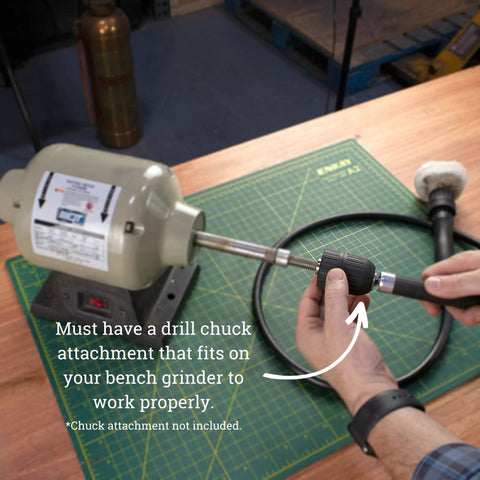 Man holding Heavy Duty Flex Shaft with 1/4 Inch Keyless Chuck 56 Inch Drill Extension Cable attached to bench grinder
