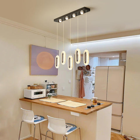 60W Dimmable LED Pendant Chandelier With Remote Control, 5-Light Slick Modern Black Fixture in a kitchen setting.