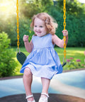 Child swinging on Heavy Duty Swing Seat With 66 Inch Chains For Outdoor Playground Use Includes Snap Hooks And Hanging Straps