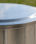 Close-up of Yukon Lid Fire Pit Cover Premium 304 Stainless Steel Round Tabletop Accessory for Wood Burning and Camping