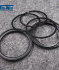 Close-up of black rubber O-rings for waterjet piston pump assemblies.