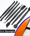 Automotive vinyl wrap tool kit, black; front view with squeegees, scrapers, edge trimmer, knife.