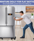 Man using Heavy Duty 2000 Lbs Furniture Dolly Set Of 4 With Ball Bearing Casters For Appliances to move fridge