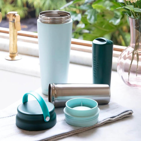 Premium Portable Breast Milk Cooler Built To Keep Pumped Storage Ice Cold For Up To 24 Hours with stainless steel and teal accents.