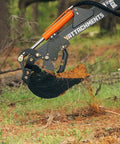 Mechanical Backhoe Thumb Attachment For Excavators Bolt On 5 Position Adjustable Thumb gripping soil in forested area