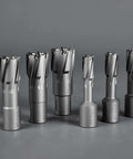 Front view: six carbide annular cutters with Weldon shanks, gray metal, varying diameters.