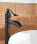 Oil Rubbed Bronze Vessel Sink Faucet Tall Waterfall With Single Handle One Hole Installation in bathroom setting