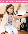 Pink Cordless Hair Trimmer Kit For Women To Snip Split Ends And Trim Bangs Or Bobs At Home With Professional Stainless Steel Blades Easy DIY Haircut Tool For Layers And Touch Ups Perfect Gift Idea being used on a girl in a chair.