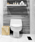 Bathroom with black louvered plastic floor register near toilet, showing durable lattice design and decorative air vent grate.