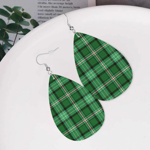 Totally Fire Green Grid Teardrop Faux Leather Dangle Earrings With Silver Plated Hooks on a plate.