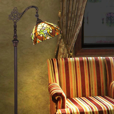 Tiffany Style Stained Glass Reading Floor Lamp With Antique Arched Tall Design 62 Inch Standing Lamp next to striped armchair