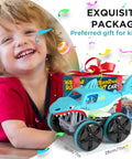 Boy with gift-wrapped 1:14 scale Amphibious RC Shark Car 2.4GHz 4WD Waterproof All Terrain Monster Truck for land and water play