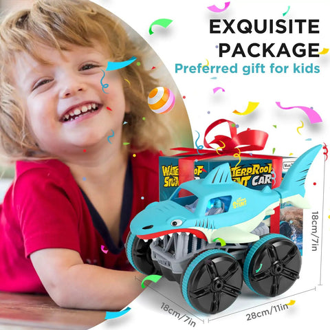 Boy with gift-wrapped 1:14 scale Amphibious RC Shark Car 2.4GHz 4WD Waterproof All Terrain Monster Truck for land and water play
