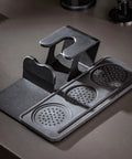 53mm Espresso Tamper Station With Spring Loaded Tamper And WDT Tool For Flawless Pulls, black plastic design with three textured pads.