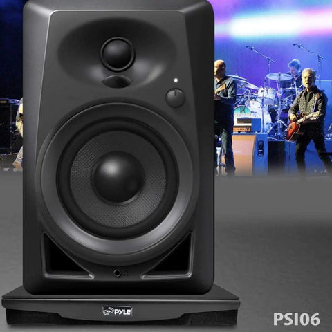 Speaker Isolation Pads For Studio Monitors Subwoofers And Loudspeakers, 10.4 By 13 Inch Foam Riser With Rubber Base in front of musicians.