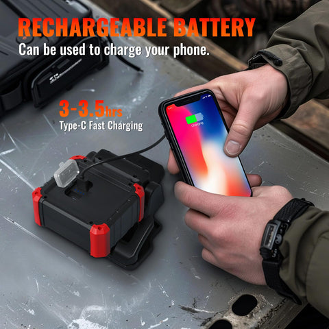 Go-To Rechargeable LED Clamp Work Light, USB Mobile Charger charging a phone on a metal surface