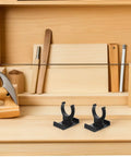 Heavy Duty Adjustable Plinth Leg Clips 12 Pack No Sweat Cabinet Leveler Hardware For Kitchen Cabinets Tables And Chairs on wooden workbench.