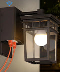 Porch Light With Built In GFCI Outlet Dusk To Dawn Exterior Wall Mount Fixture showing bulb lit and two outlets